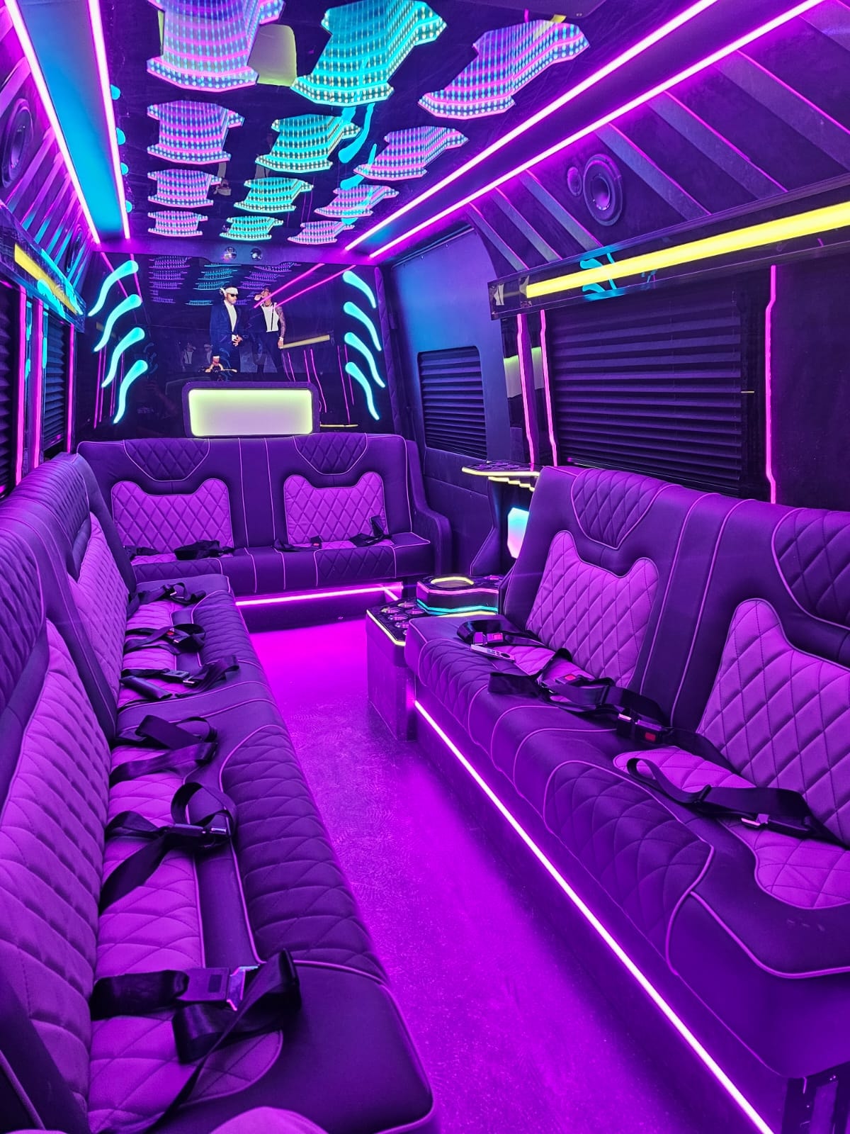 Limo Sprinter interior wide view with blue ambient lighting
